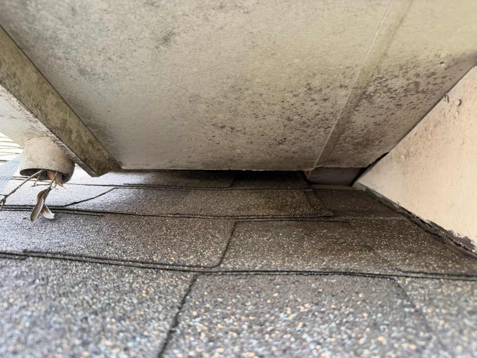 Sealed concrete foundation gap with metal barrier installed at soffit junction